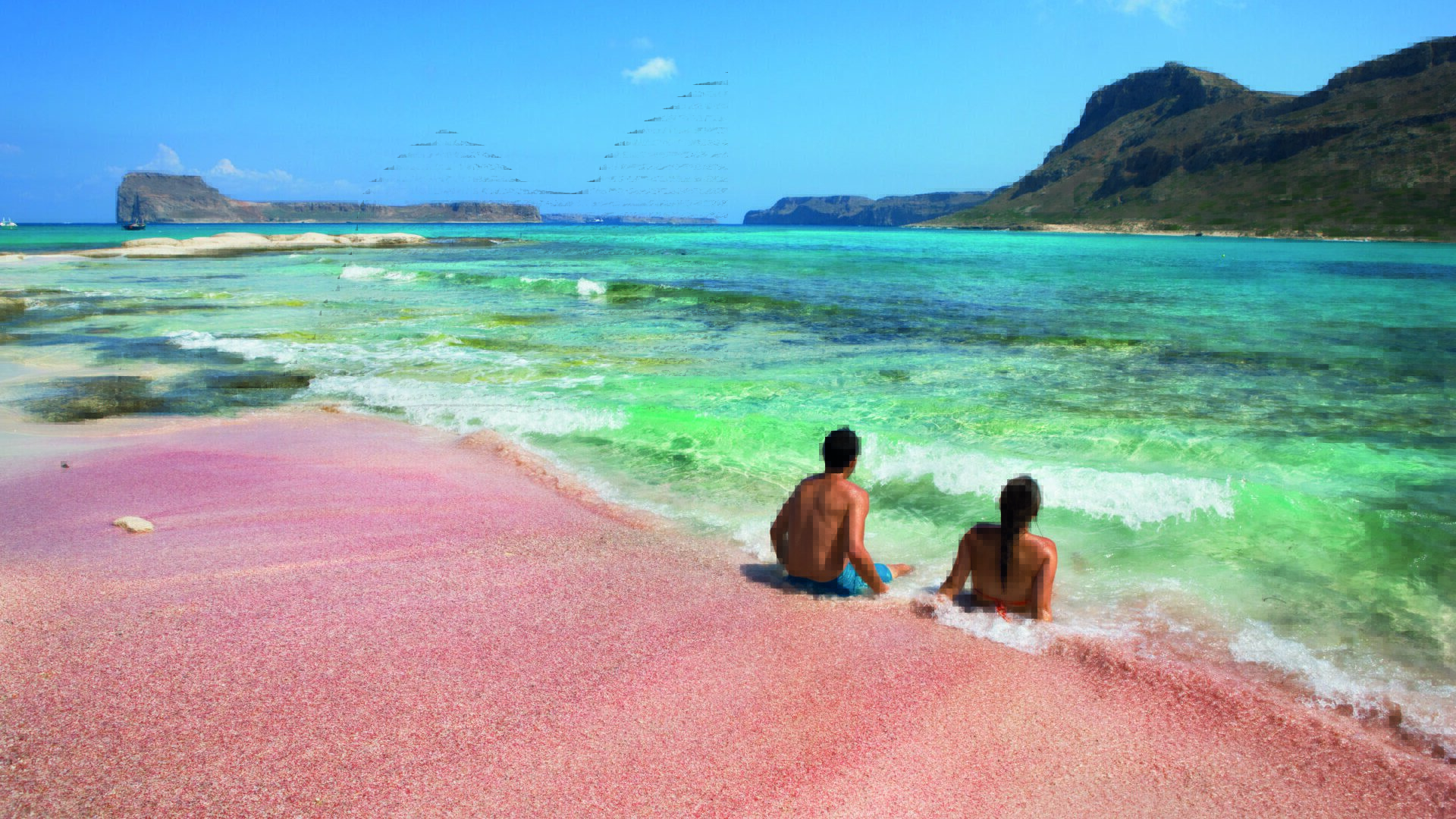 Różowy piasek i turkusowa woda na plaży Balos na Krecie